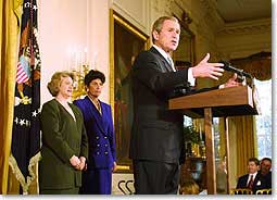 President Bush speaks to small business owners in the East Room of the White House.
