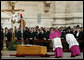 Archbishop Piero Marini, left, chief liturgist to Pope John Paul II, bows to his casket during the Pope's funeral Friday, April 8, 2005, in St. Peter's Square. White House photo by Eric Draper
